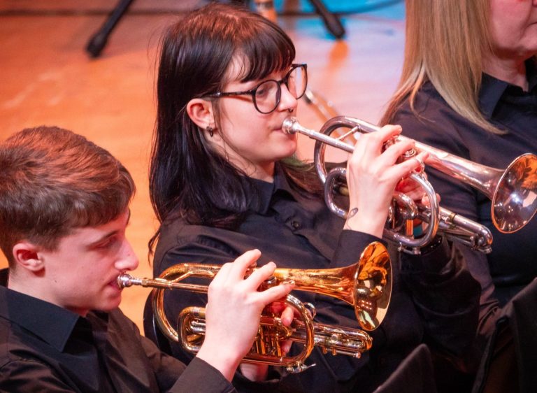 Cornet and Flugel Two females holding brass instruments